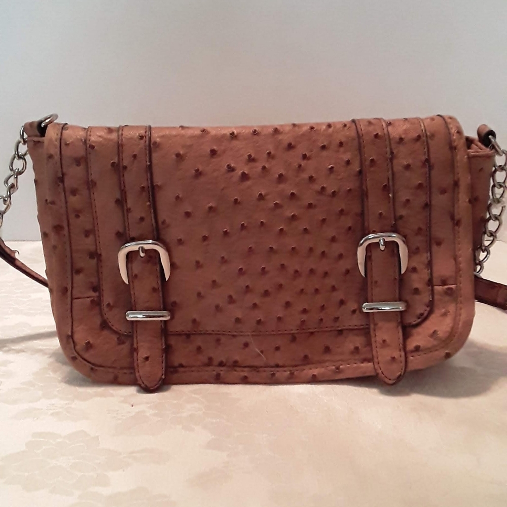 Crocodile embossed deep tan crossbody bag.
